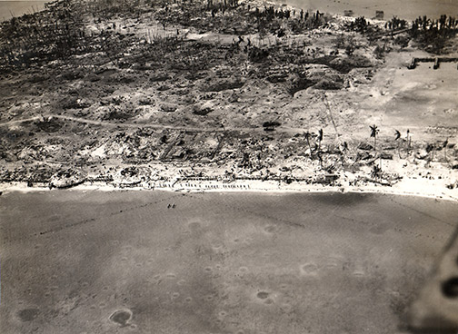 Arial photo taken in November of 1943 showing the impact of the grueling battle on Tarawa Island, in the Gilbert Atoll (Courtesy U.S. Navy National Museum of Naval Aviation).