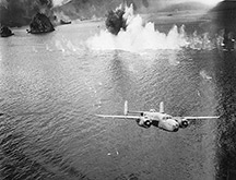 A B-25c, like the one flown by Wertz, completing a bombing run on Japanese transport in New Guinea.