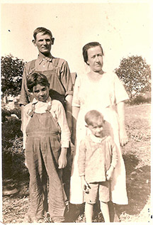 Elden Whitacre (front left) with his parents and younger brother Delmar (circa 1920).
